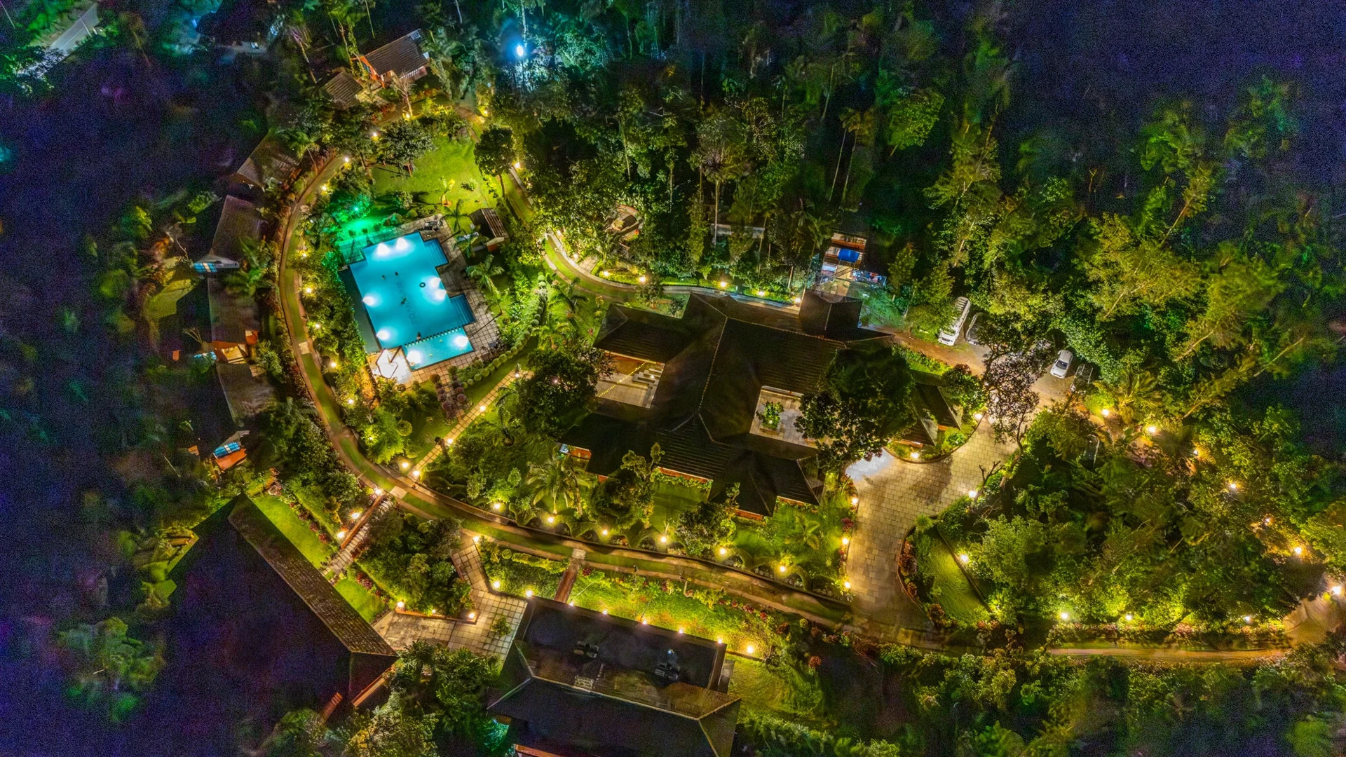 Aerial night view of Pranavam Resort nestled in nature